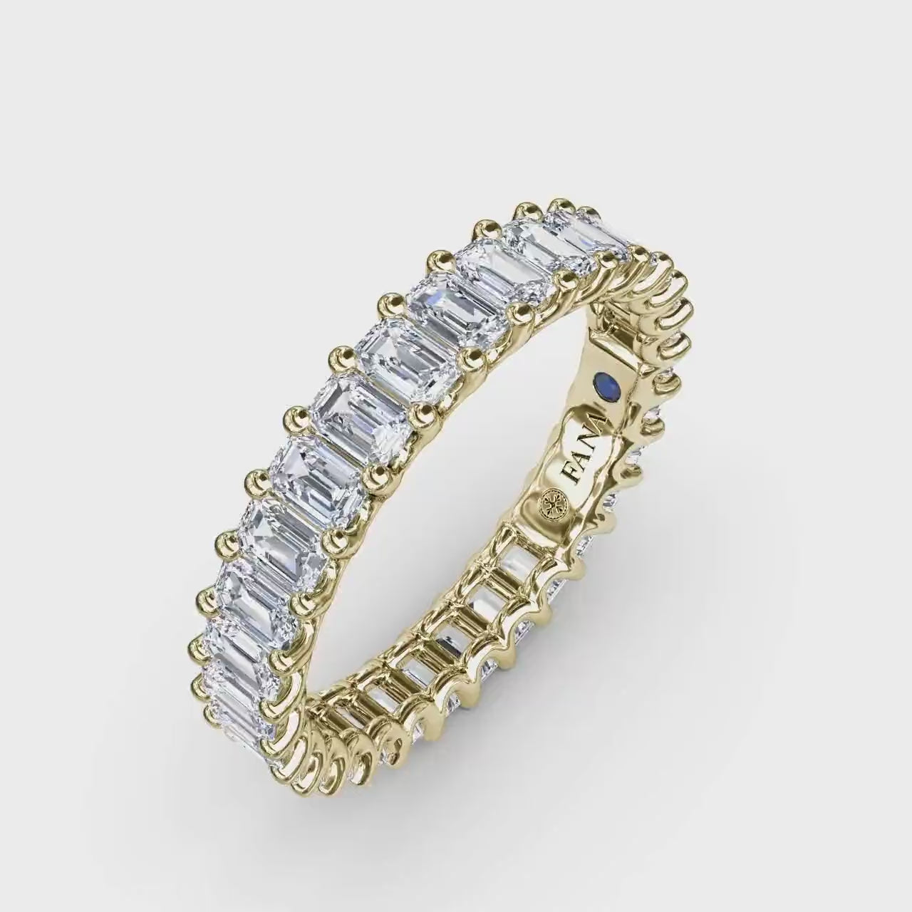 360 degree product video of the Fana W6143 14k yellow gold 2.39ct vertical emerald cut diamond eternity band, showcasing its architectural low profile and mirror-like full-circle flash at Noah's Fine Watches & Jewelry