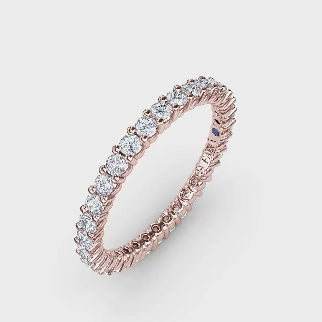 360-degree product video of the Fana W6124 14k rose gold contemporary diamond eternity band, displaying its slim profile, full-circle brilliance, and shared-prong setting at Noah's Fine Watches & Jewelry