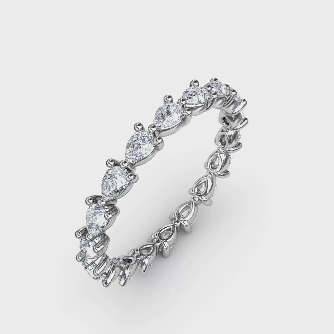 360-degree product video of the Fana W6144 14k white gold pear-cut diamond eternity band, showcasing its east-west full-circle flow and shared claw-prong layout at Noah's Fine Watches & Jewelry