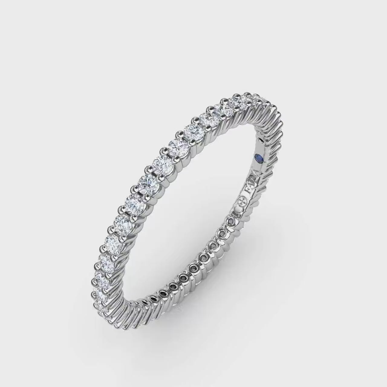 360 degree product video of the Fana W6123 14k white gold 0.50ct classic round shared prong diamond eternity band, highlighting its minimalist low profile and continuous loop of light at Noah's Fine Watches & Jewelry