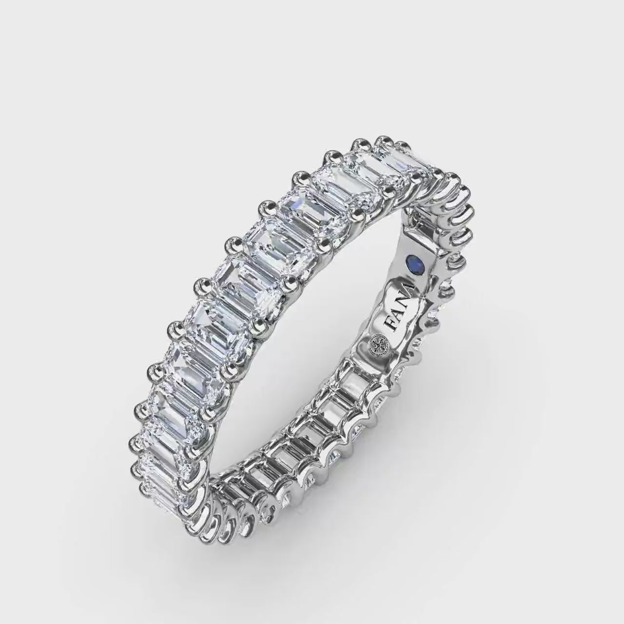 360-degree product video of the Fana W6143 14k white gold 2.39ct emerald cut diamond eternity band, showcasing its full-circle flash and architectural low profile at Noah's Fine Watches & Jewelry