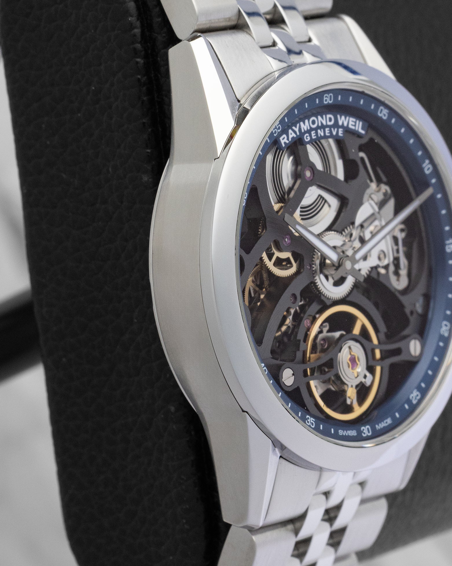 Left side profile view of the slim 10.8mm stainless steel case and faceted lugs on a Raymond Weil Freelancer watch