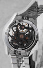 Transparent sapphire exhibition caseback revealing the black ruthenium-coated movement and signature W-shaped oscillating rotor