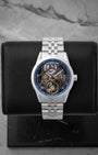 Raymond Weil Freelancer Skeleton 38mm watch featuring a blue chapter ring anthracite openwork bridge and an exposed balance wheel
