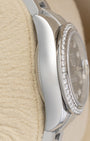 left non-crown side profile view of a stainless steel 26mm Rolex Lady-Datejust case showcasing its high-polish finish and diamond bezel overhang