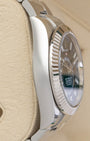 left non-crown side profile view of a stainless steel Rolex Sky-Dweller case showcasing its high-polish finish and substantial lugs