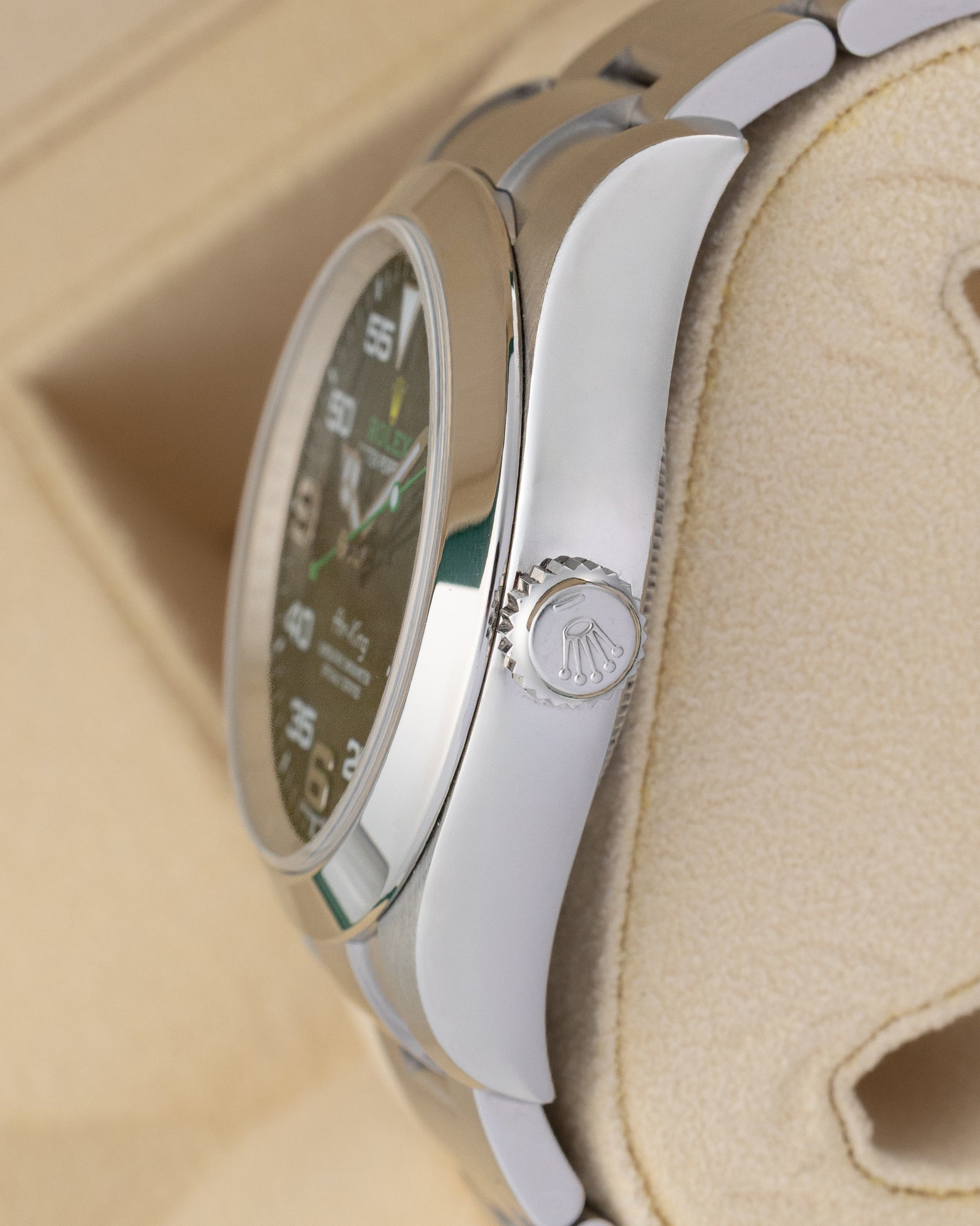Side profile view of the Rolex Air-King 116900 polished stainless steel case and winding crown