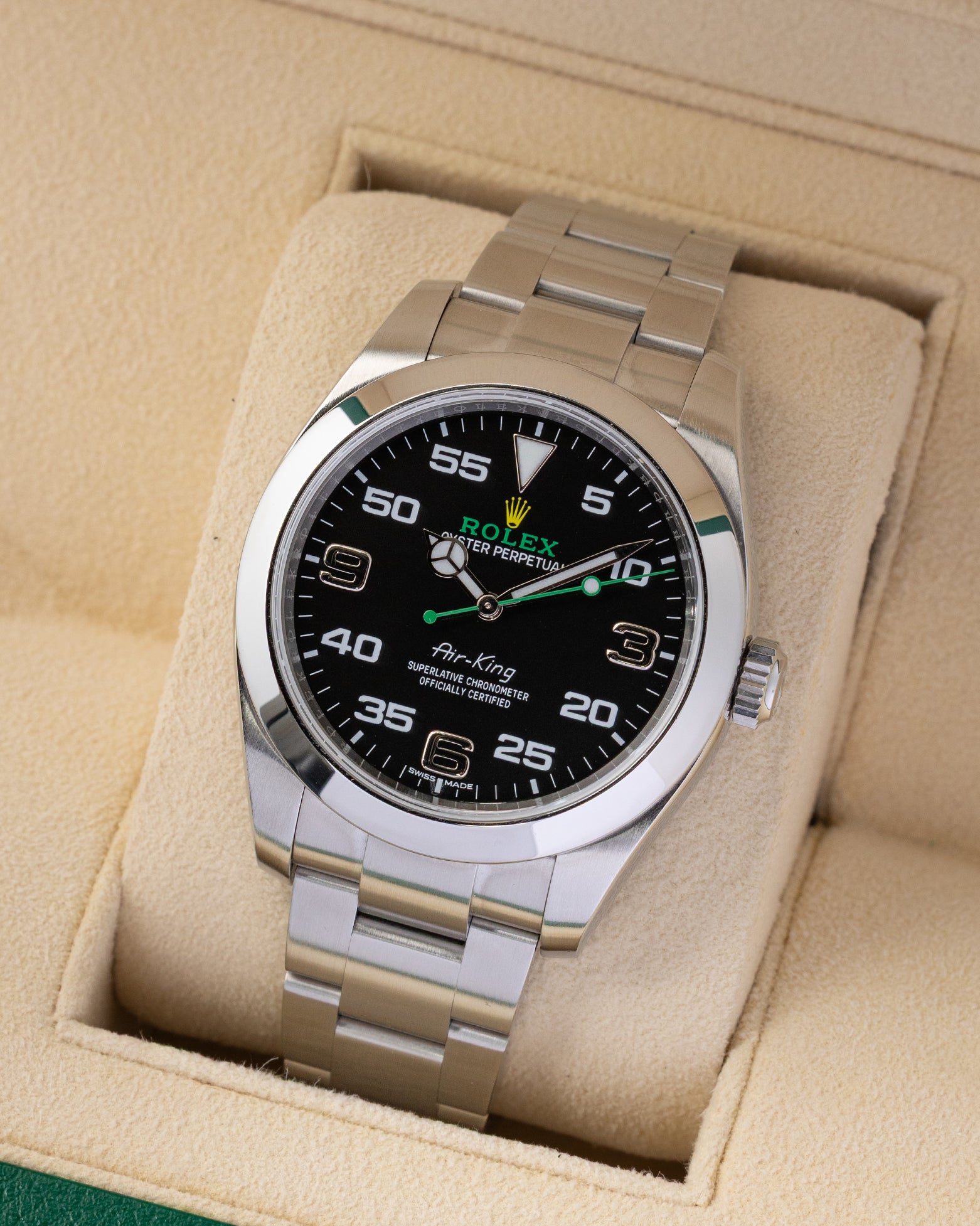 Angled view of the Rolex Air-King 40mm 116900 showing the black dial, green second hand, and stainless steel Oyster bracelet