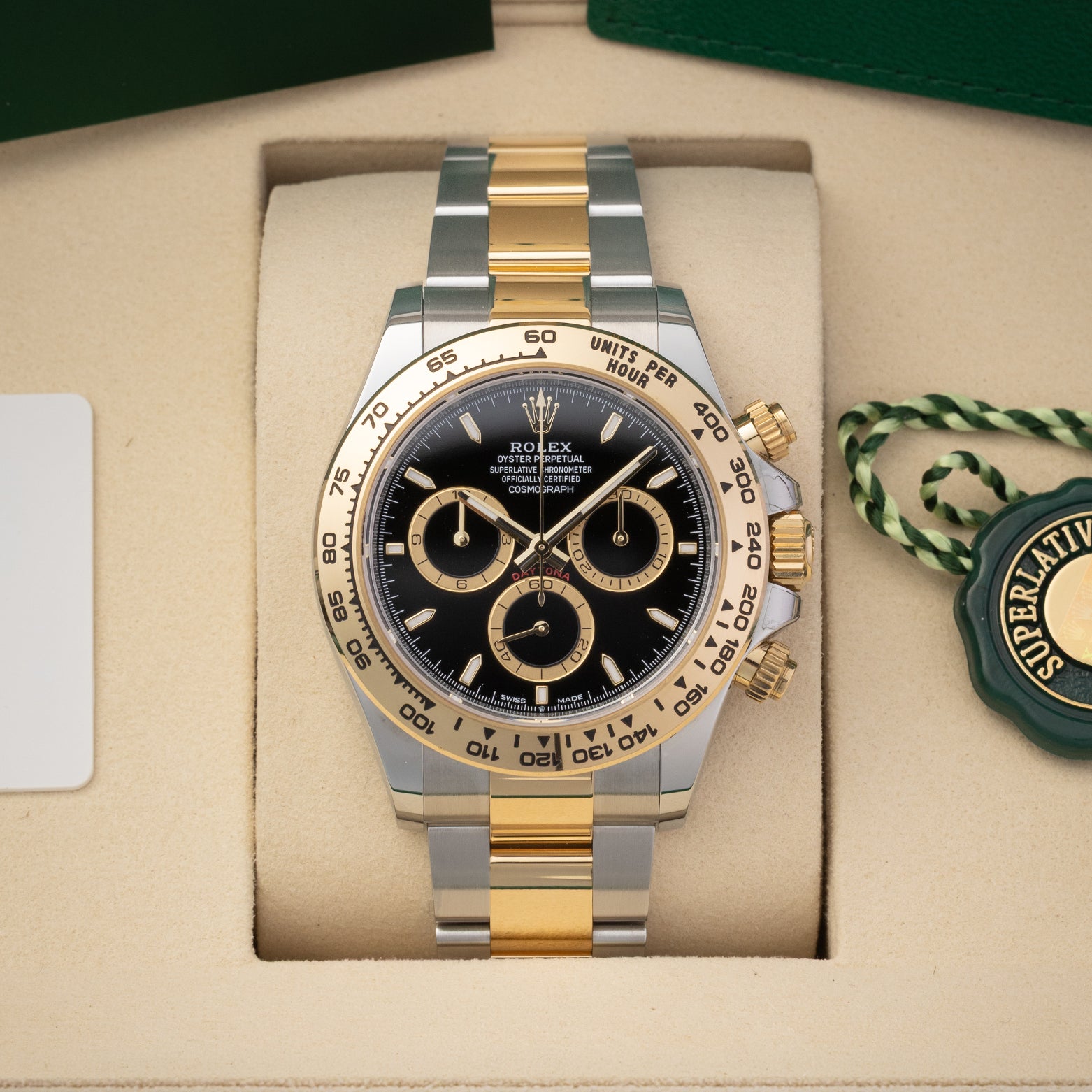 Pre owned 2026 Rolex Cosmograph Daytona 126503 two-tone Yellow Rolesor watch with black dial in display box at Noah's Fine Watches & Jewelry in Dallas, Texas
