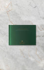Official green Rolex Cosmograph Daytona instruction booklet included with watch set at Noah's Fine Watches & Jewelry.