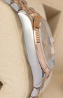 Left-side macro profile view showcasing the mirror-polished finish across the Oystersteel caseband wall and the clean integrated curve of the professional lugs