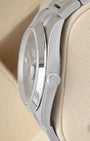 Side profile view of a stainless steel Rolex 126300 case highlighting the polished smooth bezel and signed Twinlock screw-down crown
