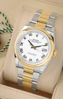 angled view of Rolex Datejust 36 126203 featuring a white dial, 18k yellow gold Roman numerals, and Oyster bracelet