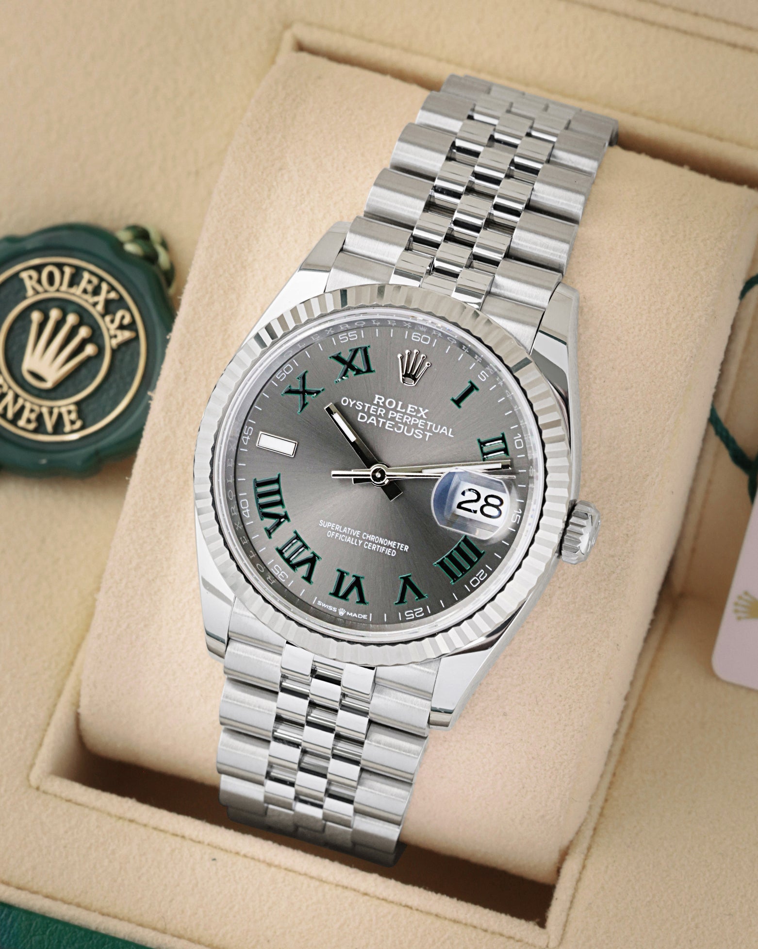 angled view of Rolex Datejust 36 126234 featuring a slate Wimbledon dial, green Roman numerals, and Jubilee bracelet
