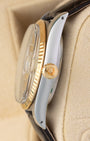 Right side profile of a 1986 Rolex Datejust 16013 highlighting the raised acrylic crystal, 18k gold fluted bezel, and gold winding crown.