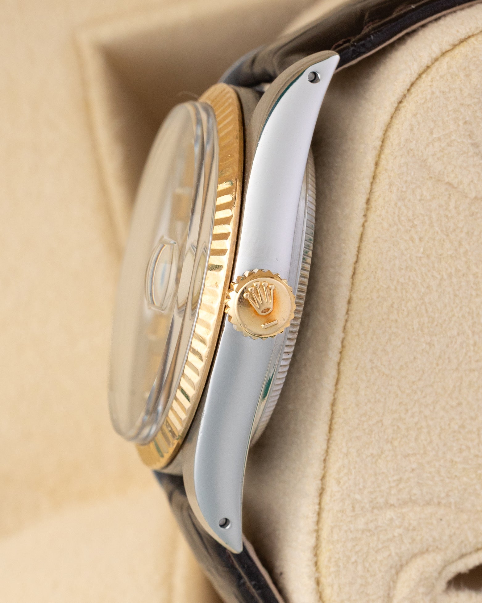 Right side profile of a 1986 Rolex Datejust 16013 highlighting the raised acrylic crystal, 18k gold fluted bezel, and gold winding crown.