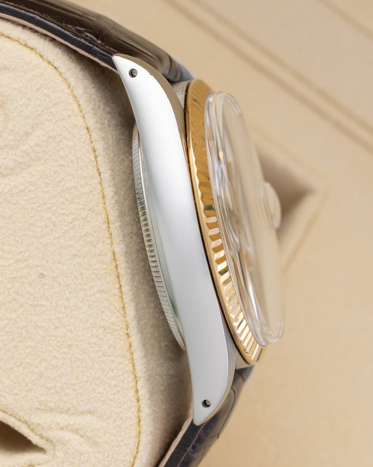 Left side profile view showing the stainless steel case with visible lug holes on a 1986 vintage Rolex Datejust reference 16013.