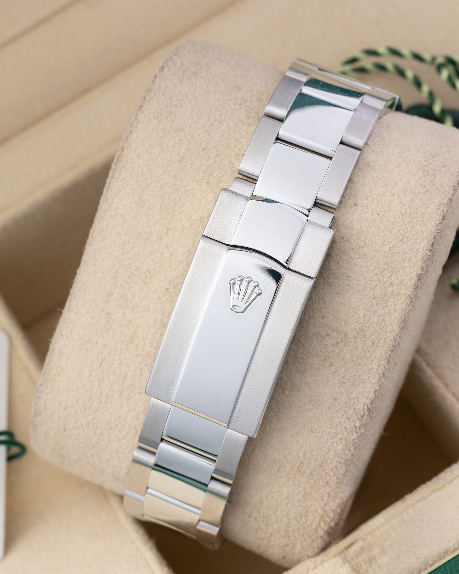 Rear view of the stainless steel three-link Oyster bracelet showing the folding Oysterclasp with the embossed Rolex crown coronet logo