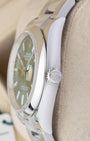 stainless steel case profile view showcasing the smooth bezel edge and Twinlock winding crown on a 36mm Rolex Datejust