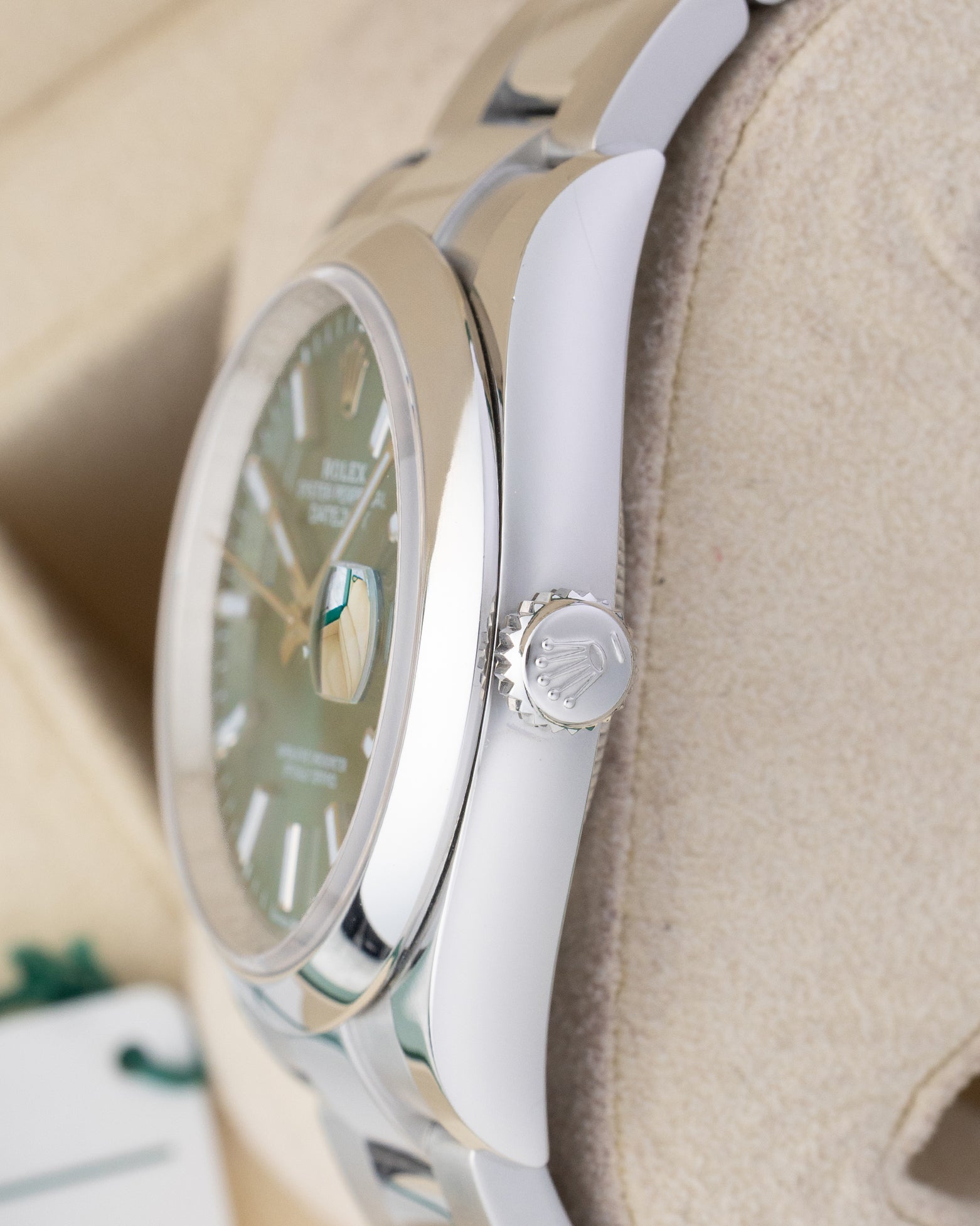 stainless steel case profile view showcasing the smooth bezel edge and Twinlock winding crown on a 36mm Rolex Datejust