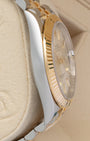Polished steel case profile and fluted gold bezel view of pre-owned Rolex Datejust 41 on presentation pillow