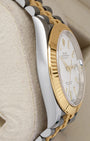 left-side case profile view of a pre-owned steel and 18k yellow gold 41mm Rolex Oyster case resting on a presentation cushion