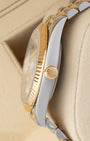 Side profile of Rolex Datejust 41 126333 showing 18k yellow gold winding crown and stainless steel case