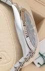 Polished stainless steel side case profile of Rolex Datejust 41 126334 on display cushion