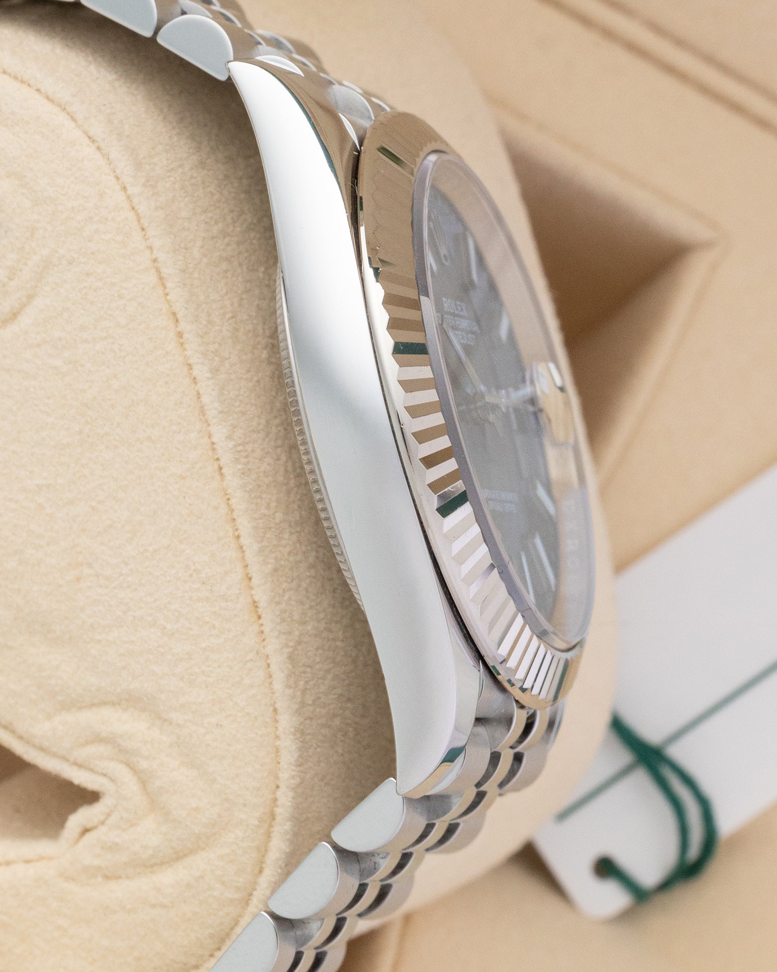 Polished stainless steel side case profile of Rolex Datejust 41 126334 on display cushion