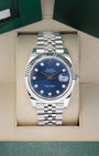 2026 Rolex Datejust 41 luxury watch with a bright blue diamond dial, model 126334, sitting in its presentation box at Noah's Fine Watches & Jewelry in Dallas