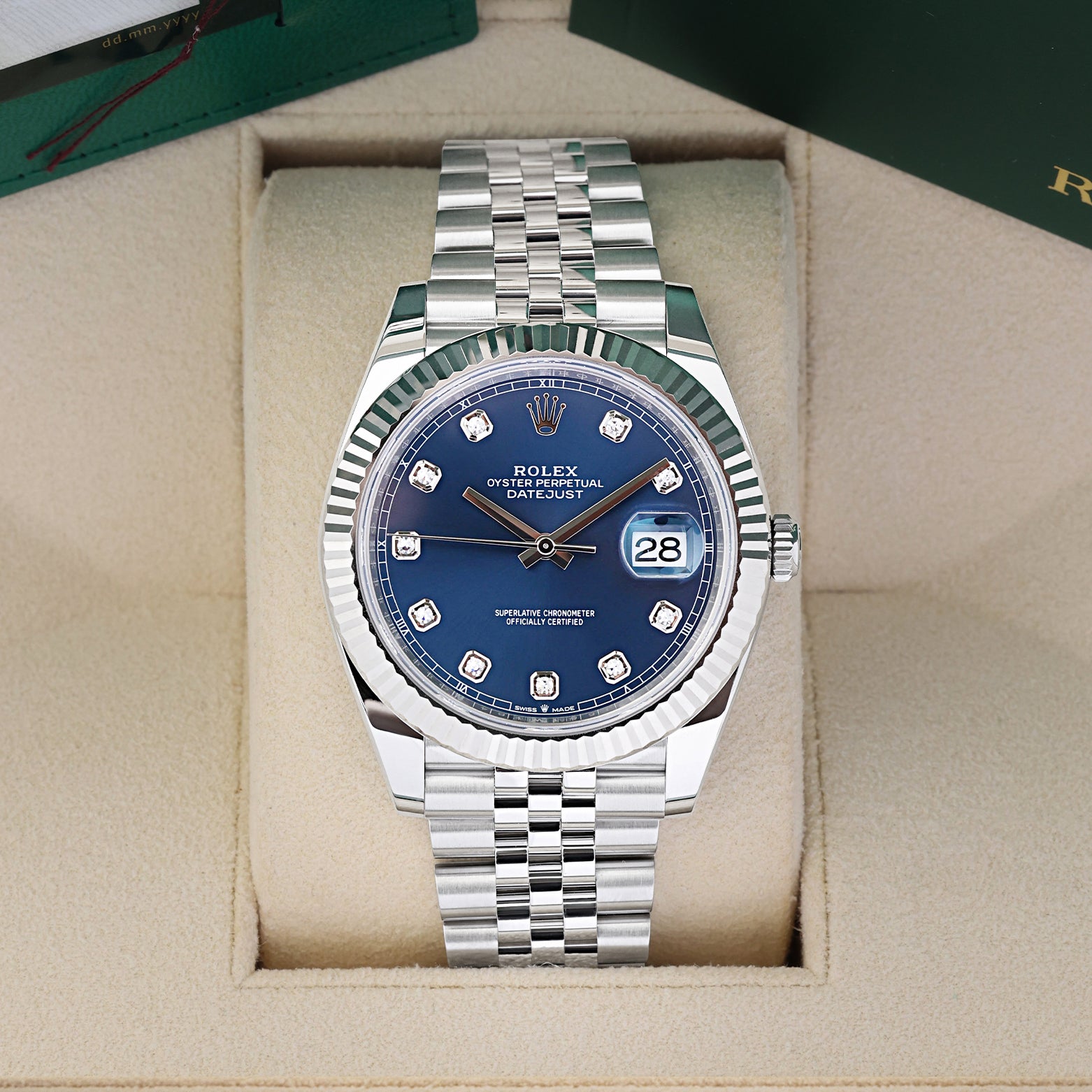2026 Rolex Datejust 41 luxury watch with a bright blue diamond dial, model 126334, sitting in its presentation box at Noah's Fine Watches & Jewelry in Dallas