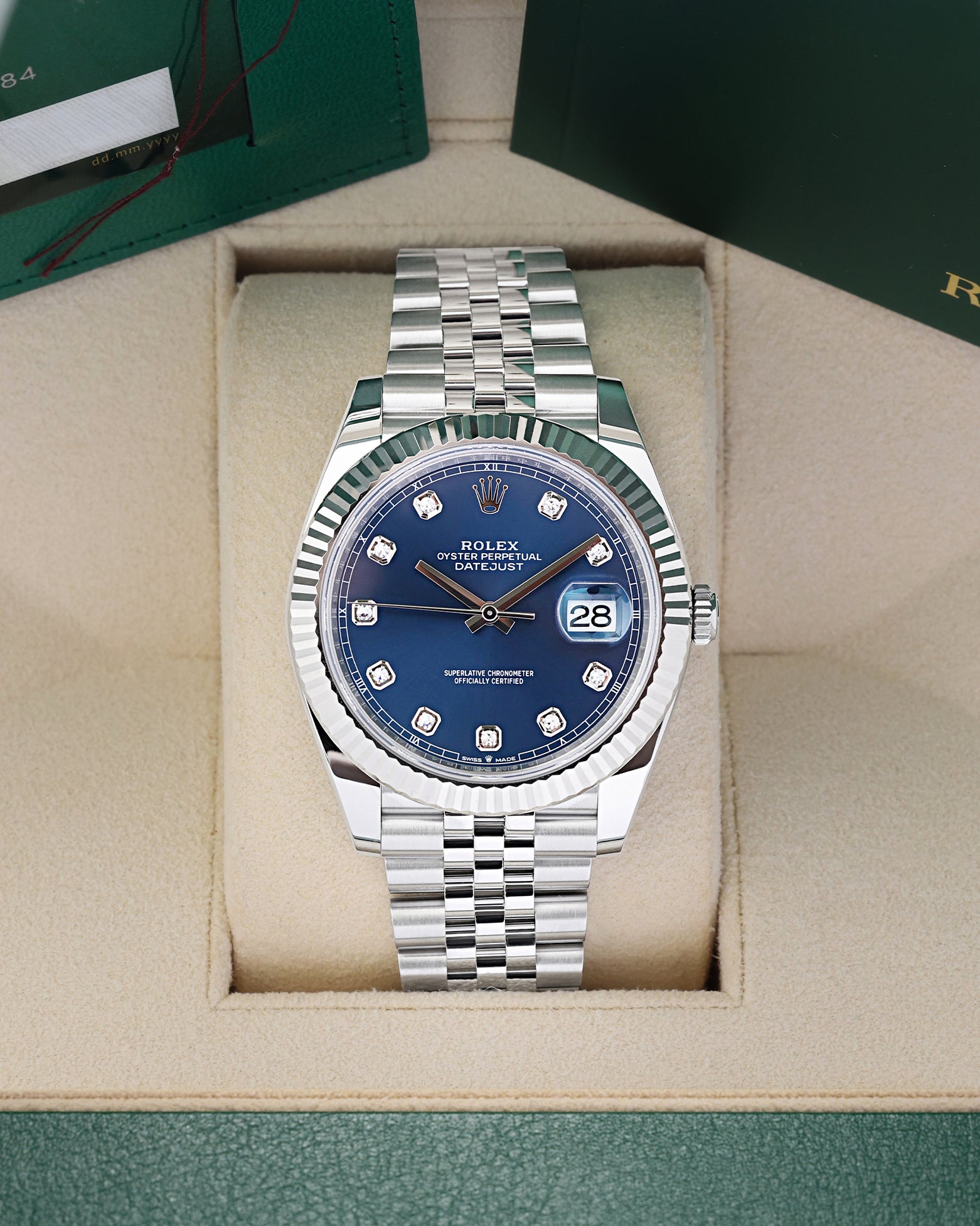 2026 Rolex Datejust 41 luxury watch with a bright blue diamond dial, model 126334, sitting in its presentation box at Noah's Fine Watches & Jewelry in Dallas