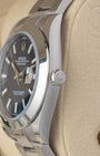 close-up view of the right side profile of a Rolex Datejust 41 case, showcasing the polished smooth bezel and the winding crown