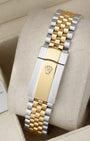Rear view of the two-tone steel and yellow gold Jubilee bracelet showing the modern folding Oysterclasp with the embossed Rolex crown coronet logo