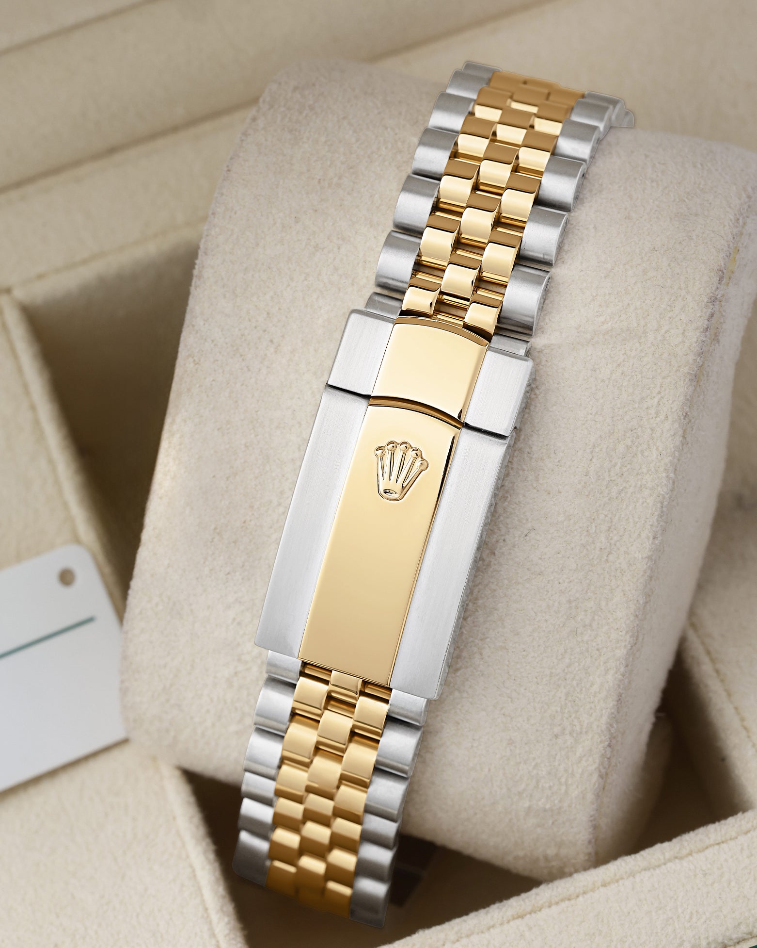 Rear view of the two-tone steel and yellow gold Jubilee bracelet showing the modern folding Oysterclasp with the embossed Rolex crown coronet logo