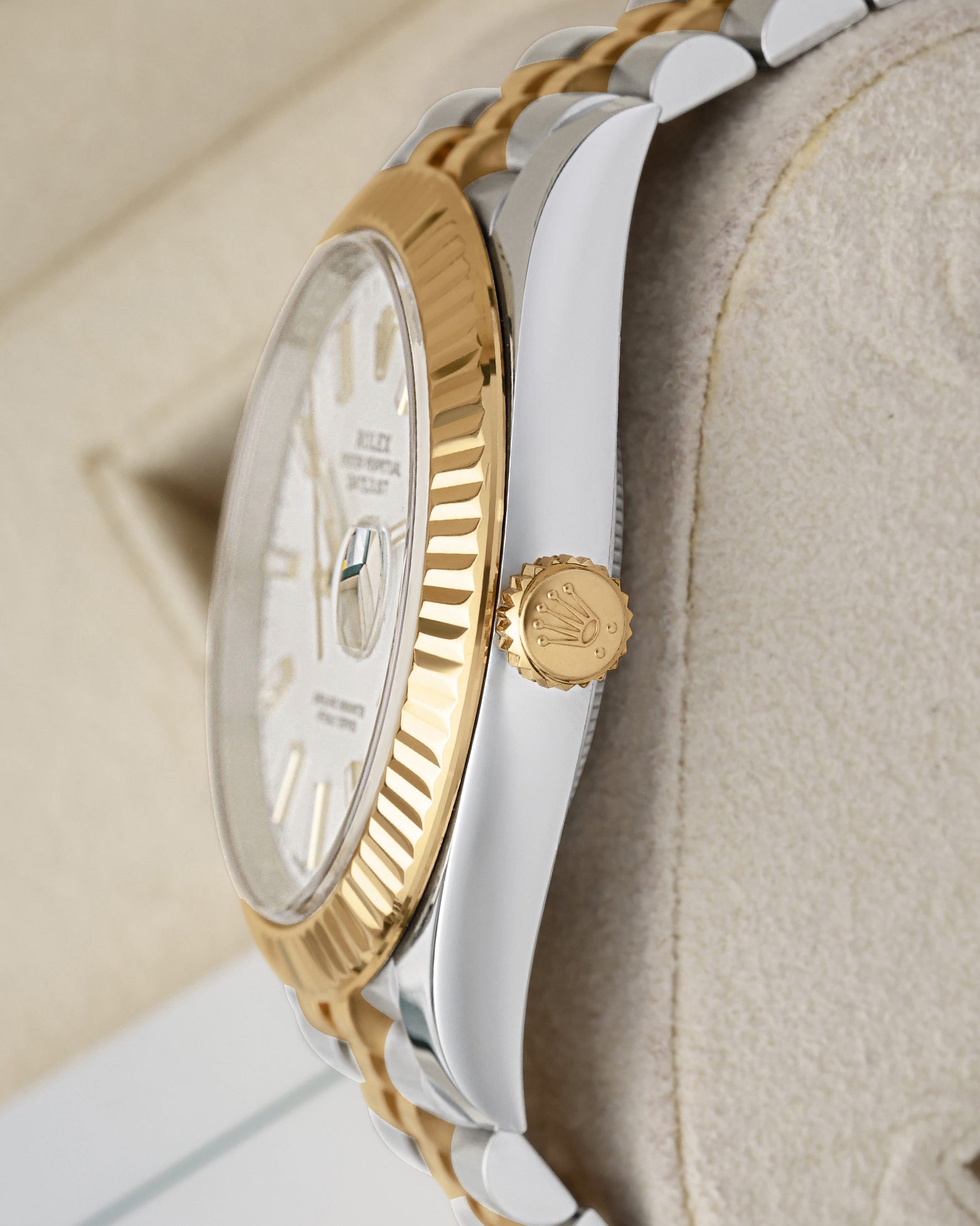Two-tone case profile view showcasing the 18k yellow gold screw-down winding crown on a 41mm Rolex Datejust