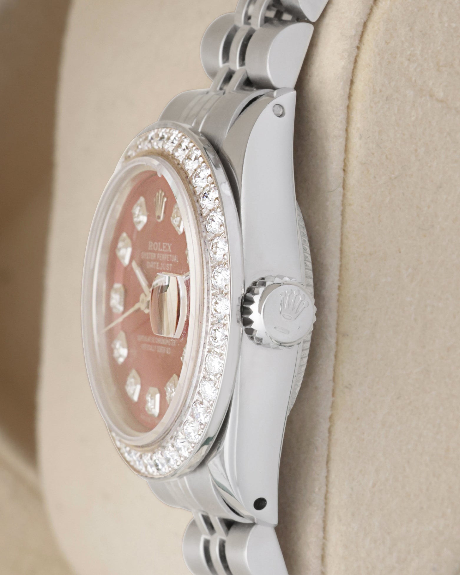 Side profile view of a vintage Rolex Lady-Datejust 6917 showing the diamond bezel edge and signed fluted screw-down crown