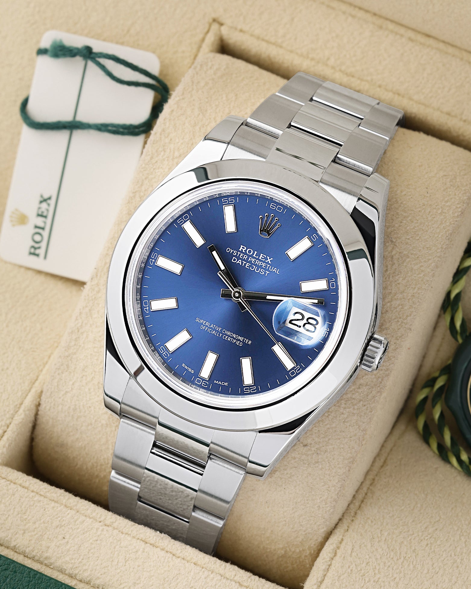 angled profile view of a pre-owned 2016 Rolex Datejust II reference 116300 showcasing the oversized blue index dial and steel Oyster bracelet