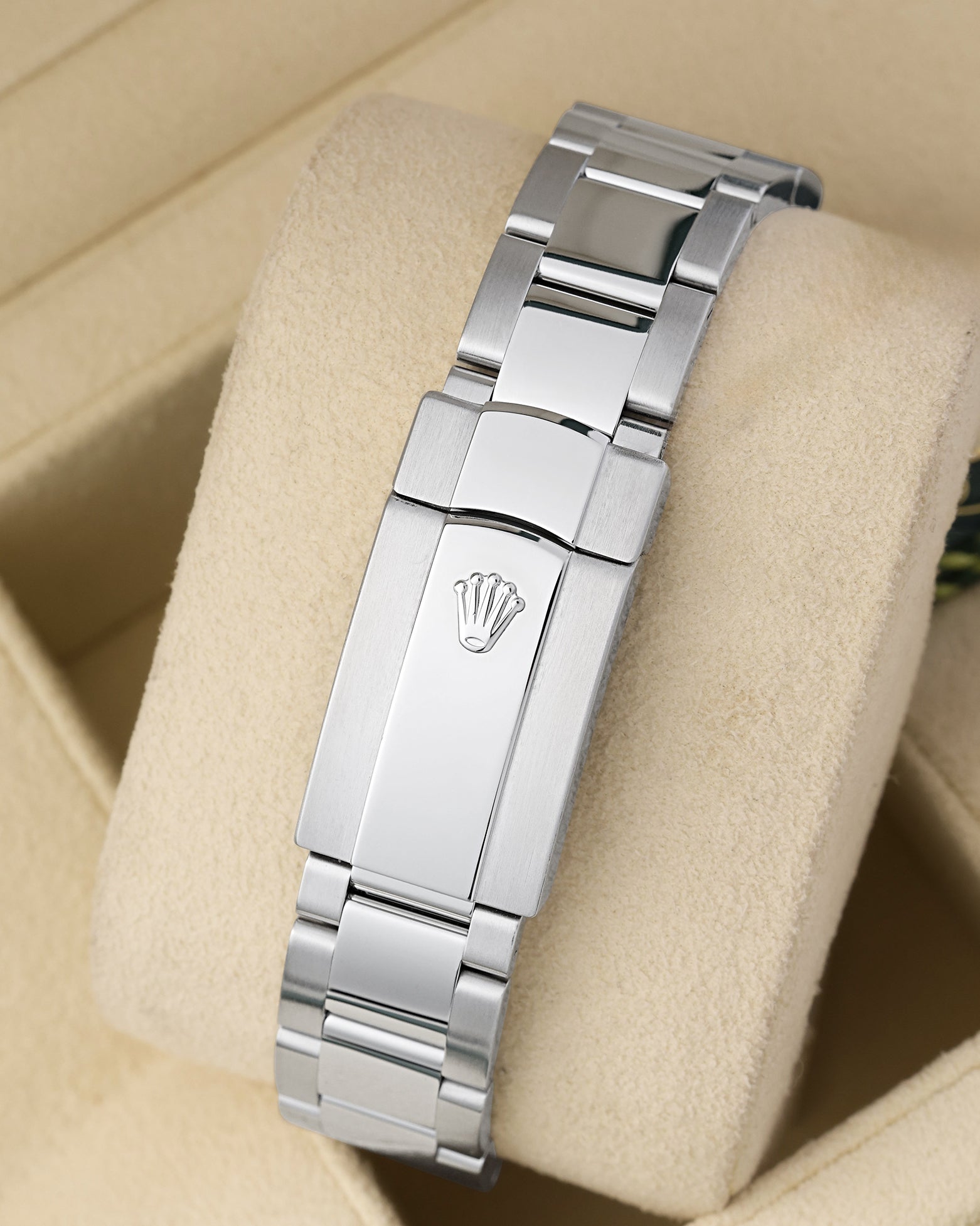 Rear view of the stainless steel three-link Oyster bracelet showing the folding Oysterclasp deployment mechanism with the embossed Rolex crown coronet logo