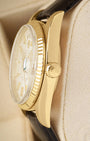 Side profile highlighting the 18k yellow gold case construction, acrylic crystal, and signature screw-down winding crown on a vintage Rolex 1803