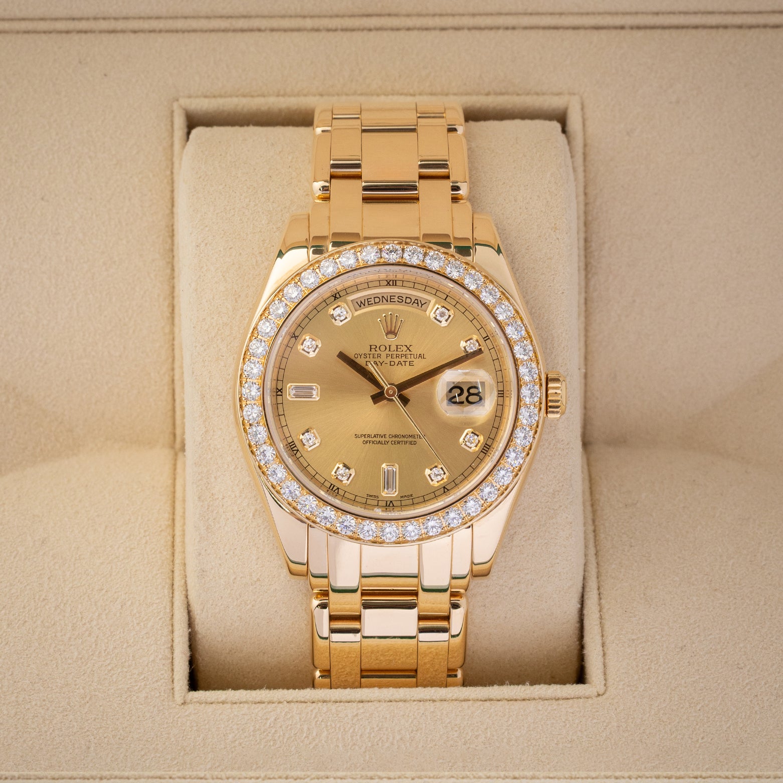 A Rolex Day-Date Special Edition Pearlmaster 39 reference 18948 in solid 18k yellow gold featuring a champagne dial, diamond hour markers, and a factory diamond-set bezel inside its box at Noah's Fine Watches & Jewelry in Dallas
