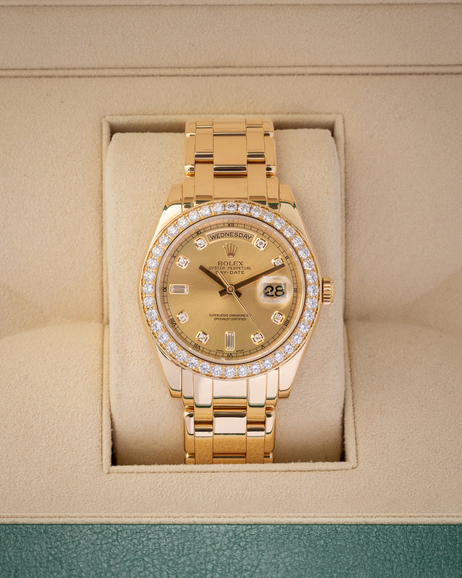 A Rolex Day-Date Special Edition Pearlmaster 39 reference 18948 in solid 18k yellow gold featuring a champagne dial, diamond hour markers, and a factory diamond-set bezel inside its box at Noah's Fine Watches & Jewelry in Dallas