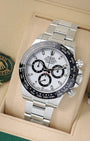 angled view of Rolex Daytona 116500LN featuring a white Panda dial, black ceramic tachymeter bezel, and steel Oyster bracelet