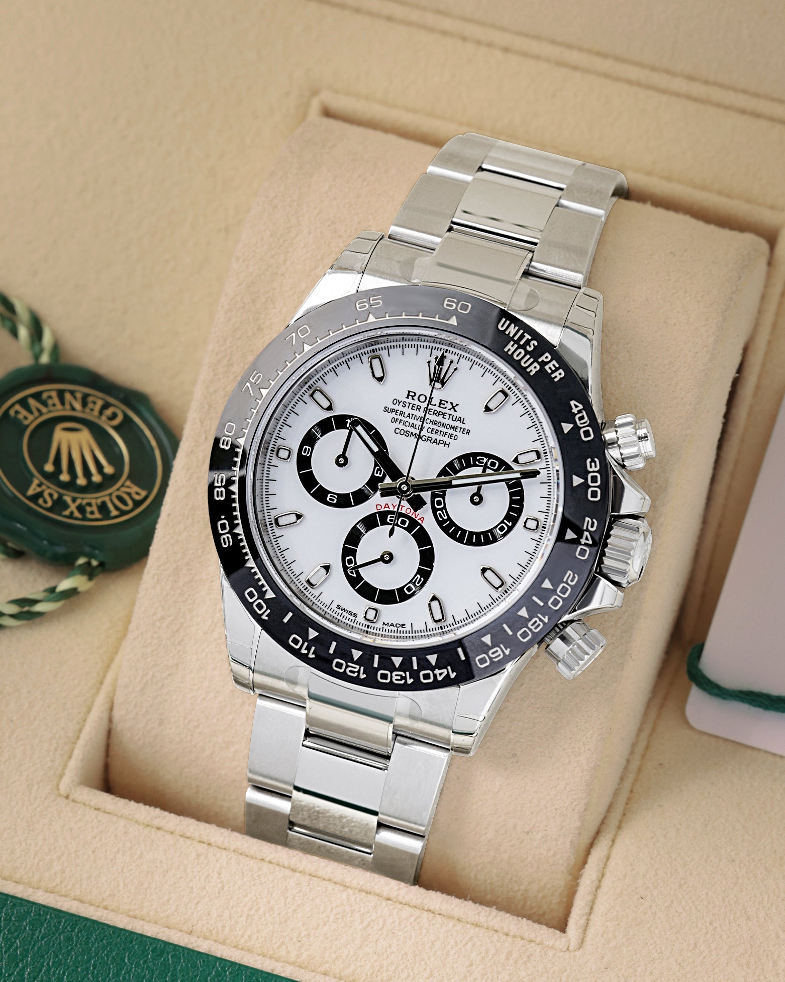 angled view of Rolex Daytona 116500LN featuring a white Panda dial, black ceramic tachymeter bezel, and steel Oyster bracelet