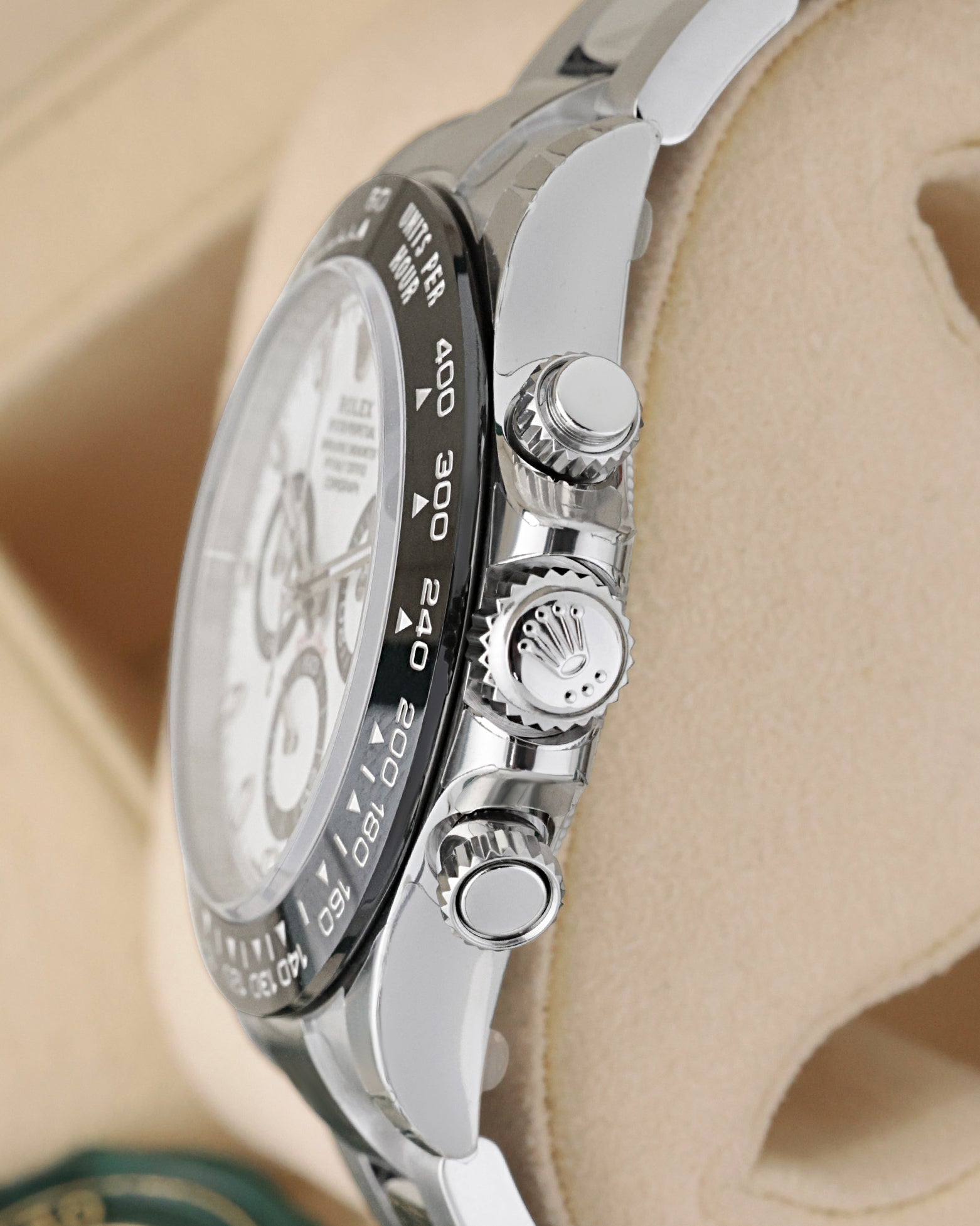 Side view close-up of the screw-down Triplock crown and chronograph pushers on a Rolex Daytona Panda 116500LN