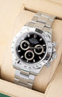 angled profile view of a pre-owned 2007 steel Rolex Daytona reference 116520 showcasing the black racing dial on its presentation cushion