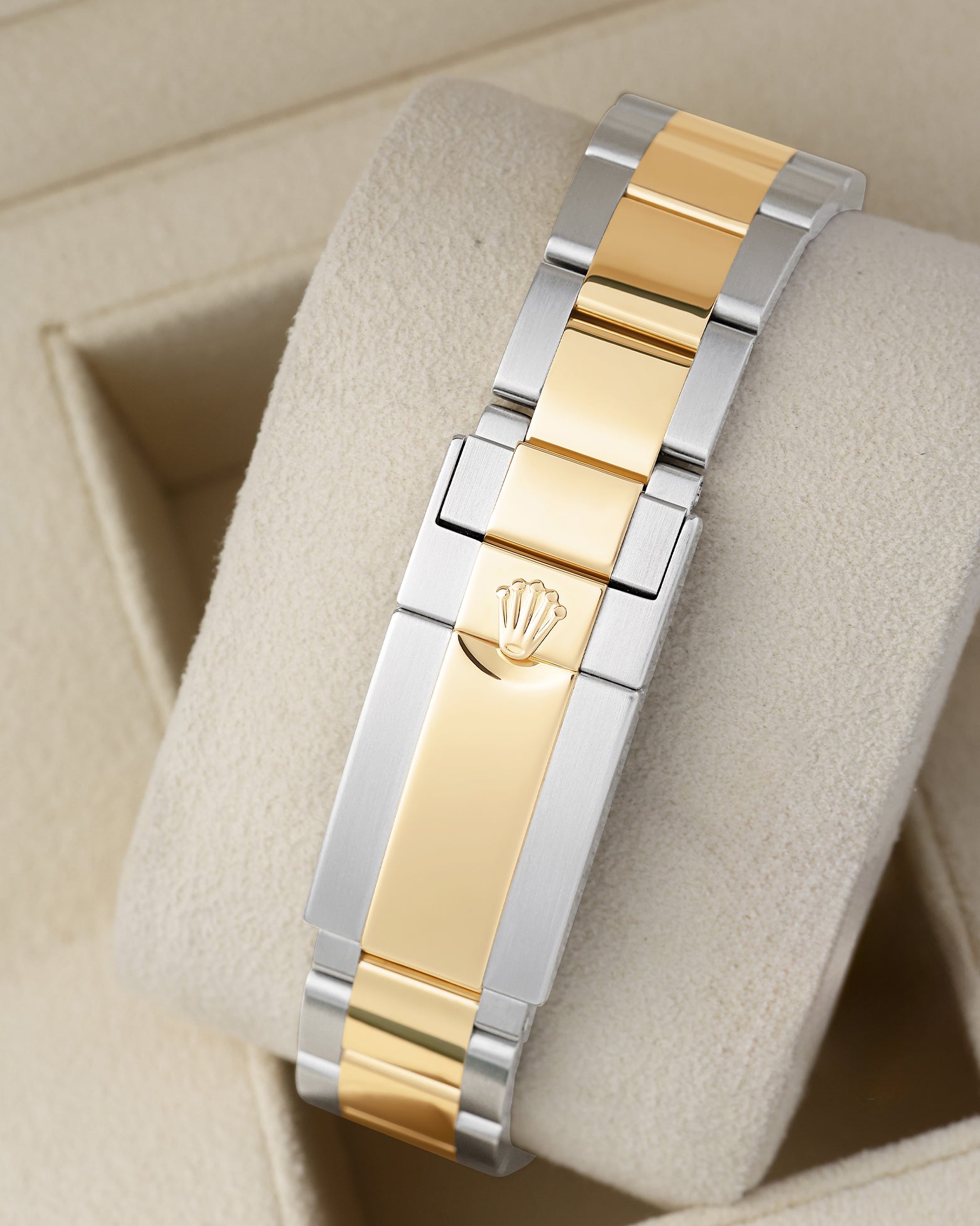 Rear view of the two-tone steel and yellow gold Oyster bracelet showing the folding Oysterlock safety clasp with the embossed Rolex crown coronet logo