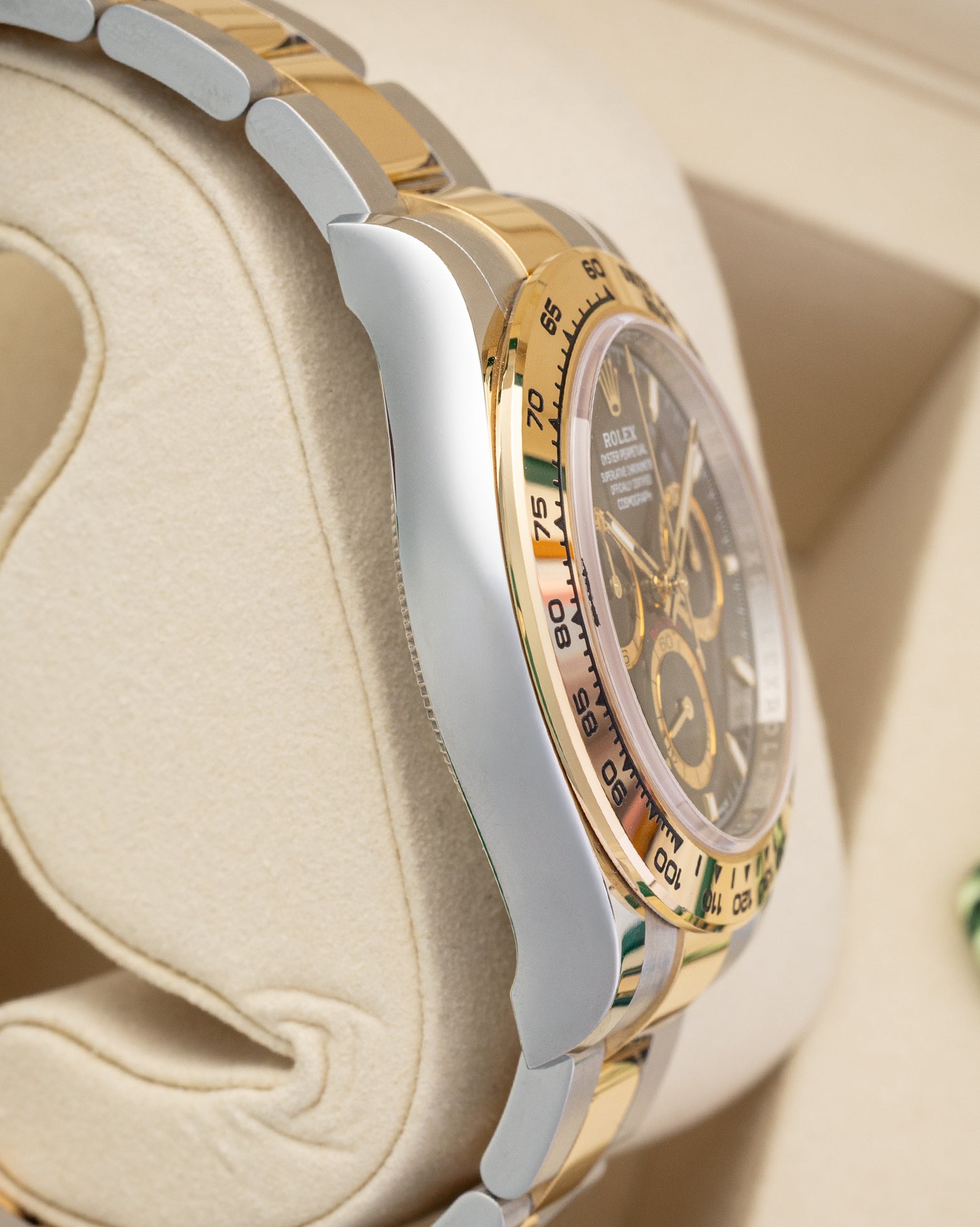 Polished Oystersteel case side view of Rolex Cosmograph Daytona 126503 pre-owned luxury watch.
