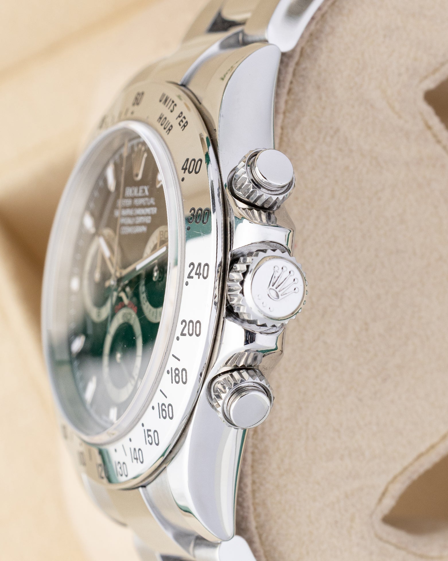 stainless steel case profile view showcasing the screw-down chronograph pushers and Triplock winding crown on a 2007 Rolex Daytona