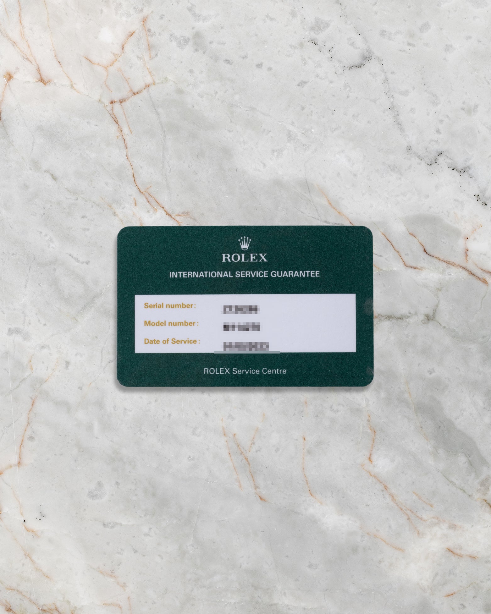 Official Rolex Service Centre warranty card showing model reference 114270 and service date